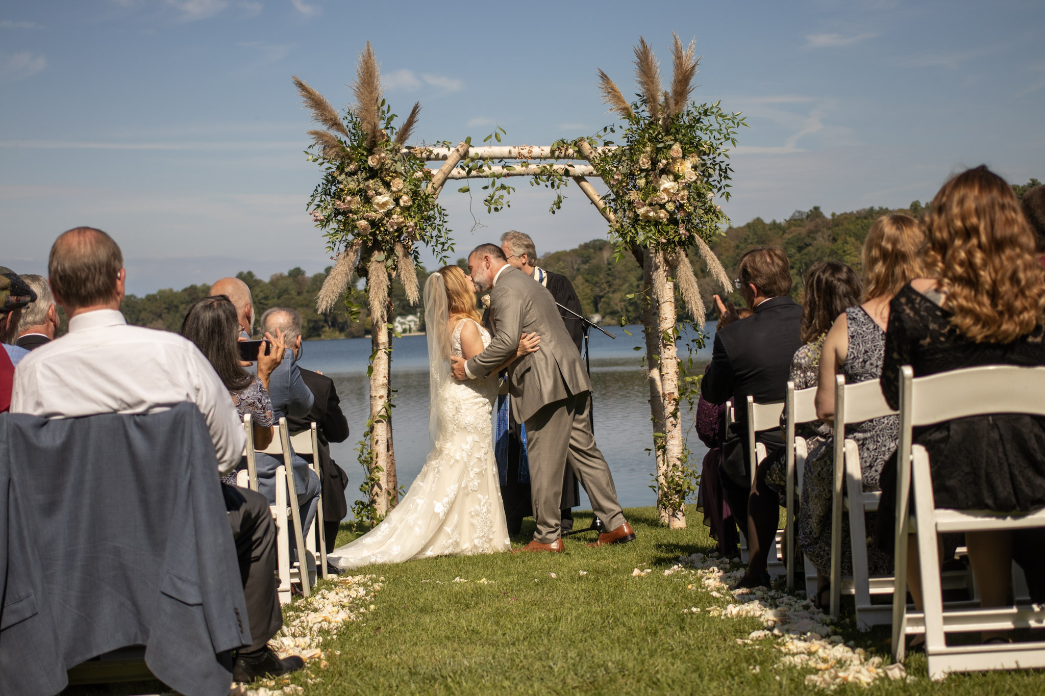 Wedding ceremony kiss by the water