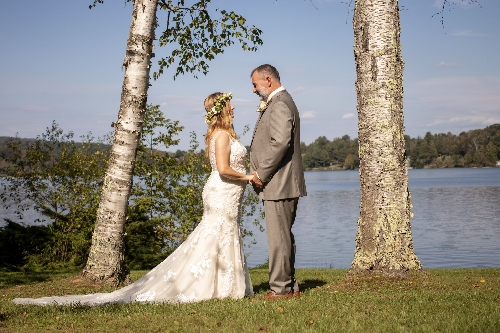 Bride and groom portrait between birch trees