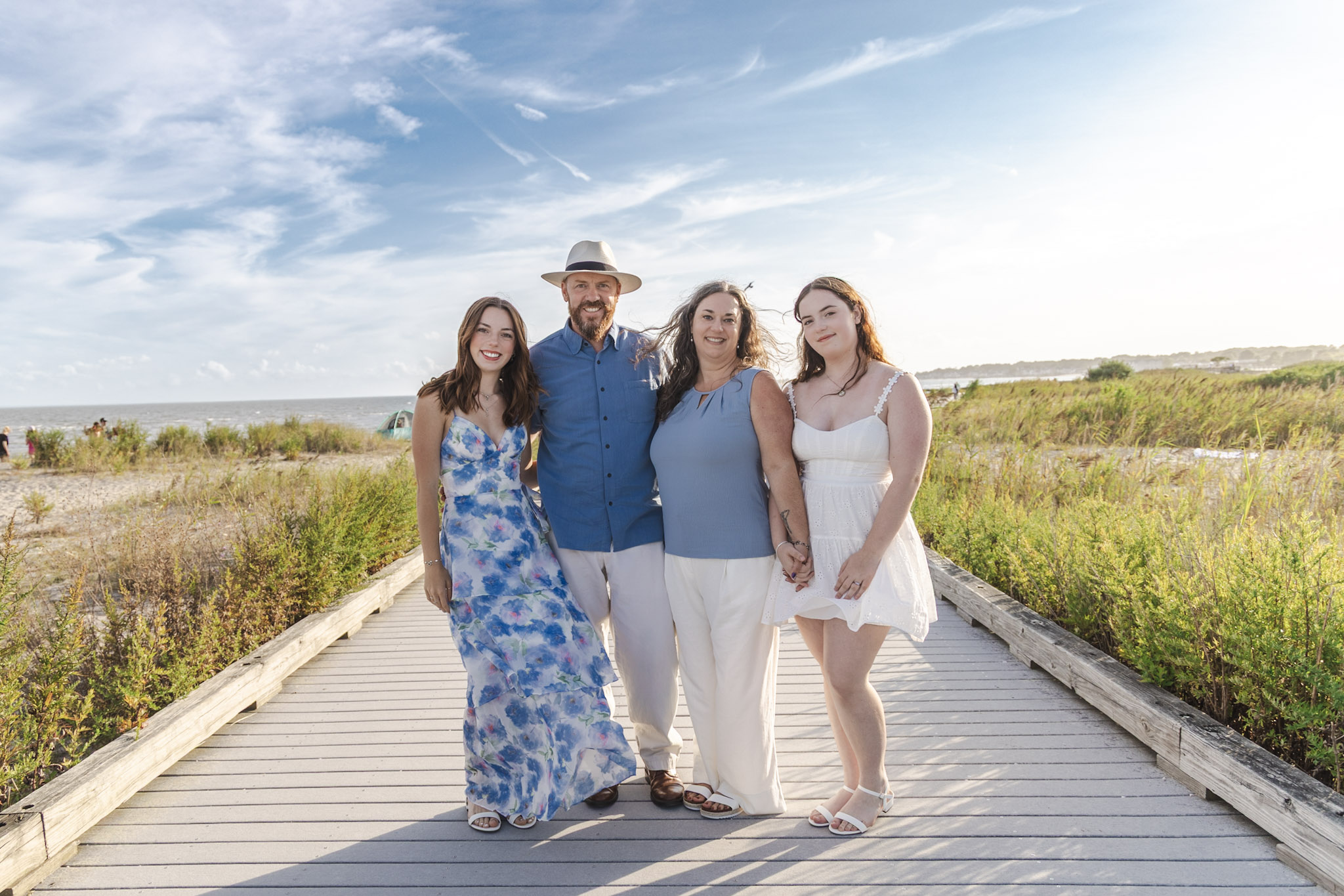 Family session on a sunny beach boardwalk