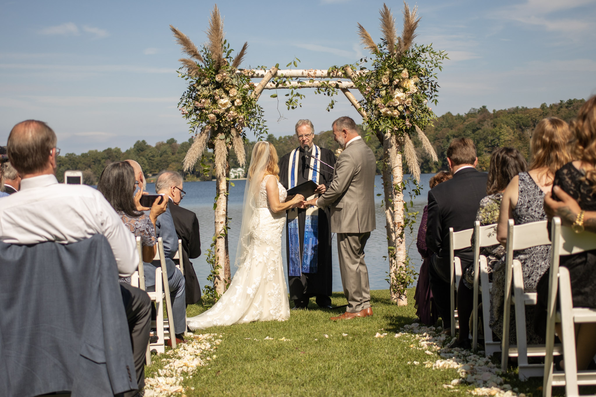 Outdoor wedding ceremony beside the water